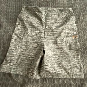 Pink athletic shorts with side pockets